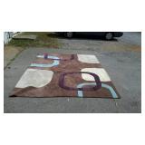 Brown wool rug with colorful design, does need to