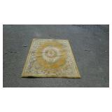 Wool area rug with flower border and center
