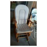 Wooden framed glider rocker with neutral colored