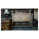 Queen size bed. Pine headboard with metal rails.