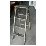 Heavy duty four step wooden ladder. Damage on