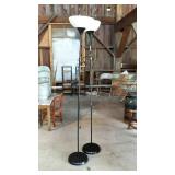 Two black floor lamps with white plastic shades -
