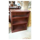 Three shelf bookcase, dark finish with a