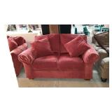 Two cushion love seat with two throw pillows,