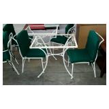 Wrought iron patio cafe table and two chairs.