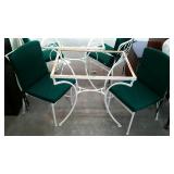 Wrought iron patio cafe table and two chairs.