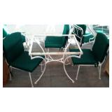 Wrought iron patio cafe table and two chairs.