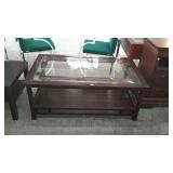 Glass top coffee table, measures 48 inches long,