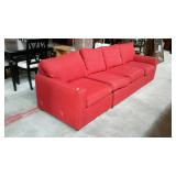 Red upholstered sofa, does need to be cleaned,