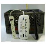 Surge protectors, milk crate full of power strips