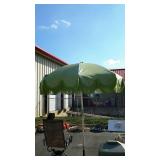 Green leather umbrella measures 7 feet when