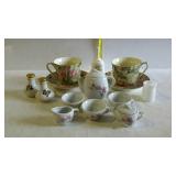 Mixed lot of rose pattern teacups with saucers, a