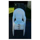 Stack of five Syroco plastic lawn chairs