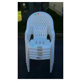 Stack of five syroco white plastic lawn chairs