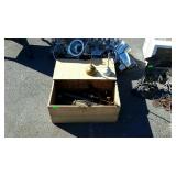 Wooden box with tools and oil cans