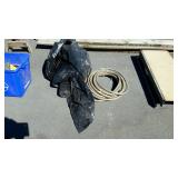 Roll of plastic, and water hose