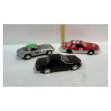 Three collector cars - one black Maisto, one grey