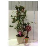 Two home decor floral arrangements in potted