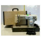 Calanda 2 portable sewing machine with case, has