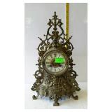 Ornate brass key wind shelf clock with pendulum -