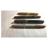 Four Fountain pens with 14 karat gold tips