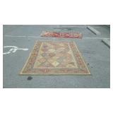 Wool oriental area rug measures 92 inches long,