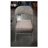 Folding metal chair with padded upholstered seat &