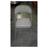 Folding metal chair with padded upholstered seat &