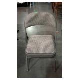 Folding metal chair with padded upholstered seat &