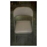 Folding metal chair with padded upholstered seat &
