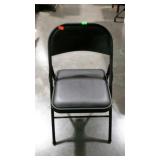 Folding metal chair with padded vinyl seat