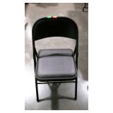 Folding metal chair with padded vinyl seat
