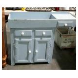 Dry sink, painted blue with white porcelain knobs-