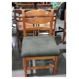 Side chair with wooden back and padded upholstery