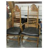 Two dining chairs with tall backs
