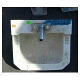 Porcelain sink with faucet