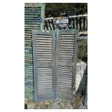 Two wooden shutters, measures 14 inches wide by