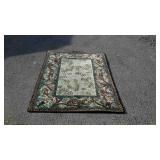 Wool area rug with jungle theme border and tree