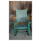Early porch rocker, slat seat and woven back.