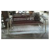 Redwood porch glider with metal frame and