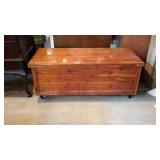 Solid cedar blanket chest, footed, shows some use