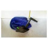Trench shovel with storage bag