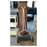 Reel mower with metal handles