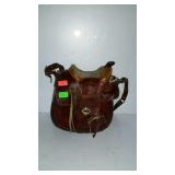 Leather saddle shape purse with rose design