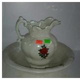 Floral washbowl and pitcher bowl has some cracks