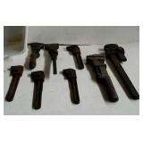 Plastic pan with 8 older pipe wrenches. All have