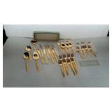 Golden Scroll flatware. Service for eight plus