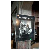 Framed wall print, "Poverty Sucks" 1977 produced