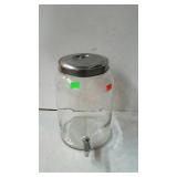 Glass lemonade jug with serving spout.