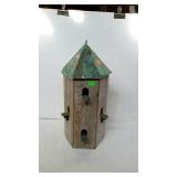 Bird house measures 25 inches tall